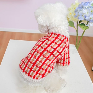 Detailed knit texture of red and white plaid pet sweater for small dogs and cats