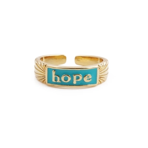 Detail of blue enamel hope ring with golden lettering and textured band finish