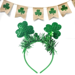Detail of St. Patrick's Day headband with sparkling green shamrocks and sequins
