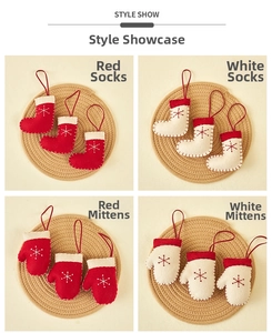 Detailed view of handmade felt Christmas ornaments in sock and glove shapes with snowflakes