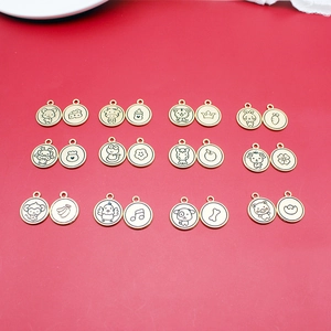 Chinese Zodiac 12-piece gold-plated alloy pendant charms set on a red background