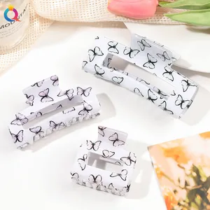 Three-piece set of butterfly print hair claws in various sizes with floral decor