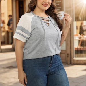 Close-up of a grey V-neck plus size T-shirt with white raglan sleeves and lace-up neck detail