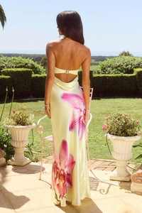 Detail of a backless floral satin dress with pink flowers and metal clasp back