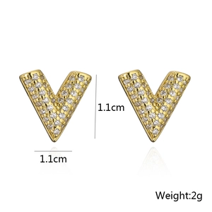 Detailed view of gold-plated V-shaped stud earrings with micro-set cubic zirconia stones