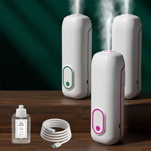 Smart essential oil diffuser set with USB cable and 45ml fragrance on wooden stand
