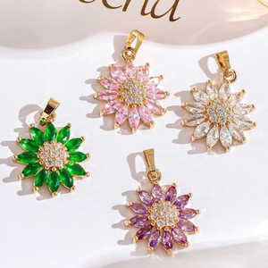 Macro shot of colorful zircon flower pendants with gold plated bases in four vibrant colors