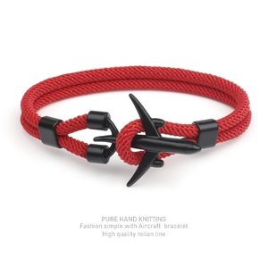 Detail shot of red braided Milan rope bracelet with black metal airplane clasp