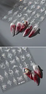 Close-up of M-841 gothic nail stickers with swords, butterflies and holographic glitter finish