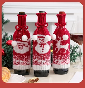 Detailed knitted Christmas wine bottle covers featuring Santa Claus, snowman, and reindeer designs