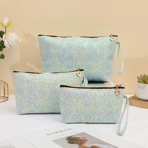 Three-piece iridescent green lace texture makeup bag set with gold zipper and handle