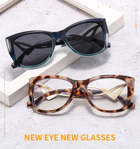 Detail der Schmetterling-Cat-Eye-Sonnenbrille mit modernem X-förmigem Metallbügel-Design