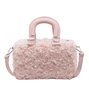 Pink lamb wool cylindrical handbag with leather handle and detachable shoulder strap