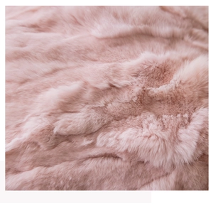 Macro shot of soft light pink faux fur texture on decorative flower sofa cushion cover