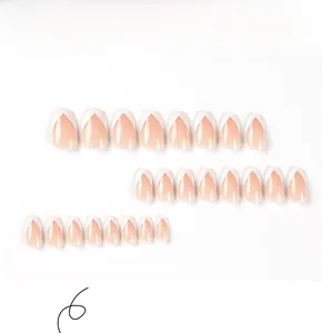 Detailed flat lay of 24 pieces almond-shaped nude pink press on nails with white V-tips
