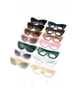 Assorted vintage cat eye sunglasses in multiple colors including black and tortoise shells