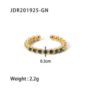 18K gold plated stainless steel ring with a round green zircon stone on a white background