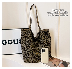 Detailed comparison showing large capacity leopard tote bag holding a smartphone