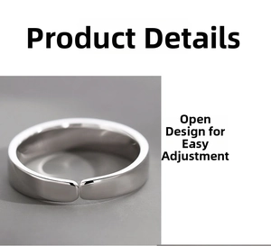 Macro detail of the adjustable open ring band with a polished silver metallic finish