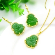Close-up of green jade Buddha pendant with gold frame and micro-pave zircon crystals