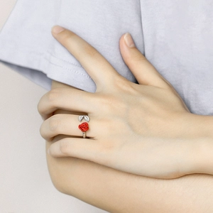 Close-up of 925 silver ring featuring a 3D red rose and sparkling zircon-set leaf design