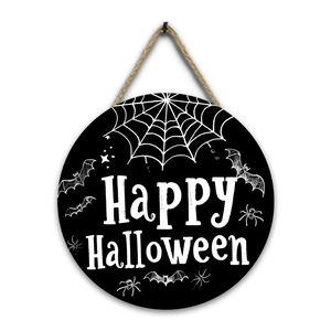 Detail of round wooden Halloween sign with Happy Halloween text and hanging jute rope