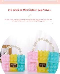Detail of gradient pop-it silicone mini bags with pearl handles and metal twist locks
