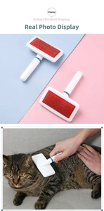 Detail view of pet needle brush for cats and dogs removing loose fur in real-life scene