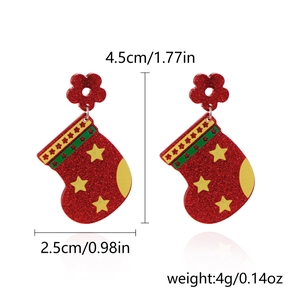 Detailed view of Christmas stocking earrings with star patterns and size measurements