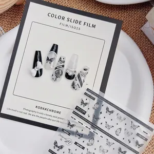 Black and white 5D dark butterfly press-on nails set with 3D bow and pearl accents