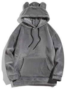 Detail of grey fleece hoodie with animal ears on hood and soft plush texture