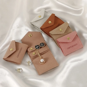 Microfiber travel jewelry roll pouches in four colors with secure golden snap closure