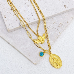 Retro gold layered necklace with angel pendant and turquoise bead on stone base