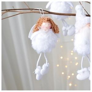 Detail of a handmade Christmas angel ornament with white plush and knitted yarn details