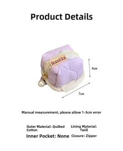 Detail of lavender quilted cotton earphone case featuring a large pearl zipper charm