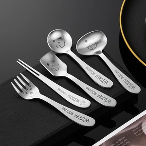 304 stainless steel dessert spoon set with cute smiley faces on black stand