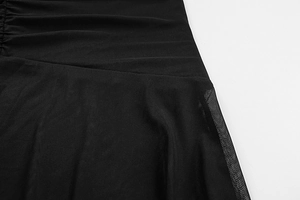 Detail of ruched black mesh fabric with semi-transparent texture on slim fit dress