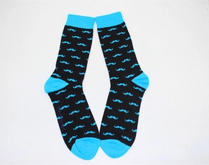 Detailed view of men's crew socks featuring a bright blue mustache pattern on black fabric
