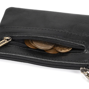 Close-up of black crazy horse leather coin pouch showing metal zipper and interior detail