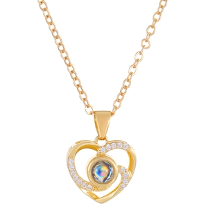 Golden heart projection necklace with white diamonds and I Love You stone on white base