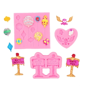 Pink silicone fondant molds for Christmas and Halloween ornaments, signs and skulls