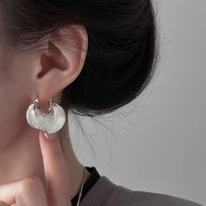 Chic silver earrings with textured pleated texture on layered silver metal hoop rings