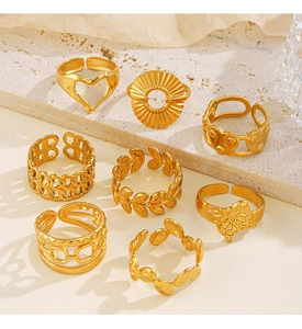 Set of 8 gold stainless steel adjustable rings with heart, butterfly and leaf motifs