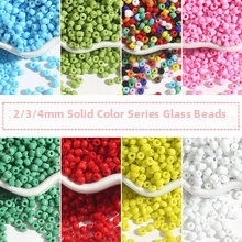 Detail of multi-colored 2mm to 4mm glass seed beads in an eight-grid layout for DIY crafts