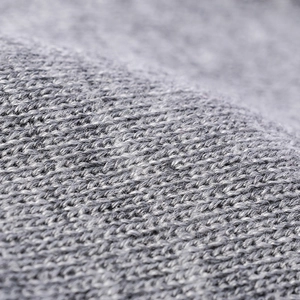 Close-up of grey jacquard knitted winter hat showing premium wool texture and weave