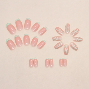 Short ballet press-on nails in nude pink and mint green with French wavy line designs