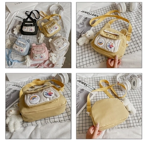 Detail of cute canvas crossbody bags with animal ears and transparent front pockets