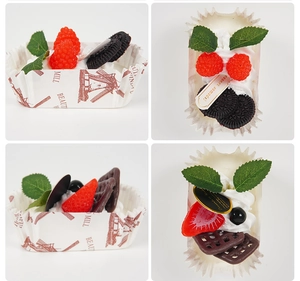 Detailed macro view of artificial fruit cupcakes with berries, cookies and cream