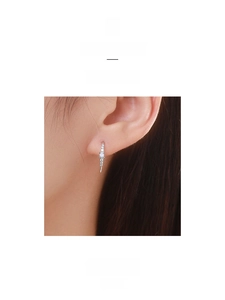 Detail shot of elegant S925 sterling silver stud earrings with round white opal and zircons