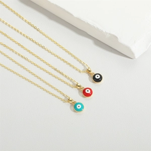 Three colorful Evil Eye pendant necklaces in gold finish on minimalist white background